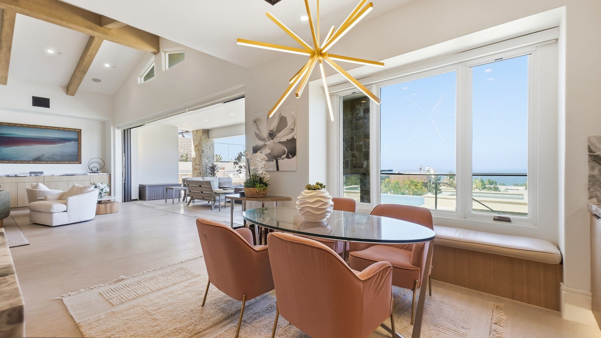 The breakfast area with a round table facing the ocean.